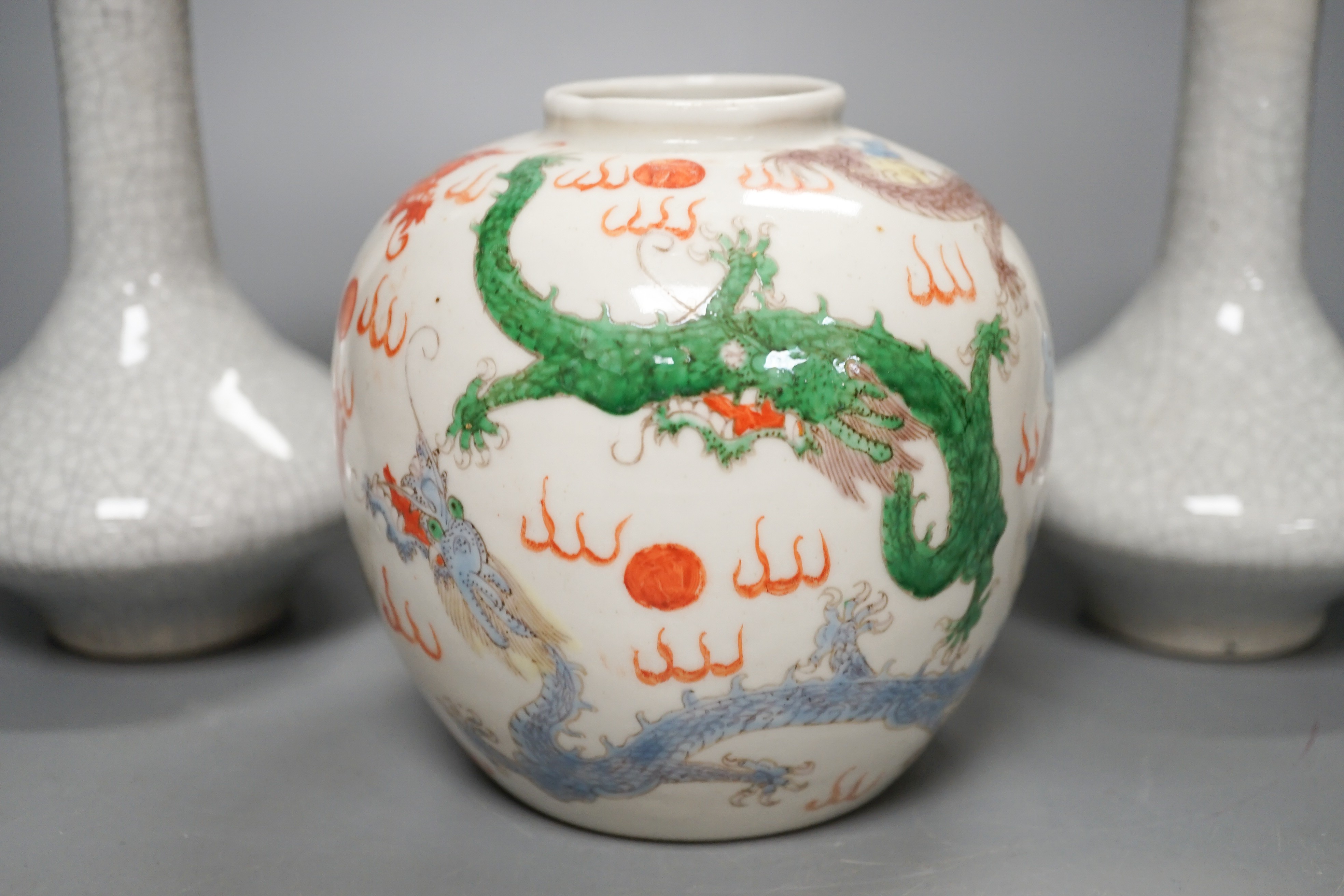 A Chinese enamelled porcelain 'dragon' jar and two crackleglaze bottle vases, tallest 19cm